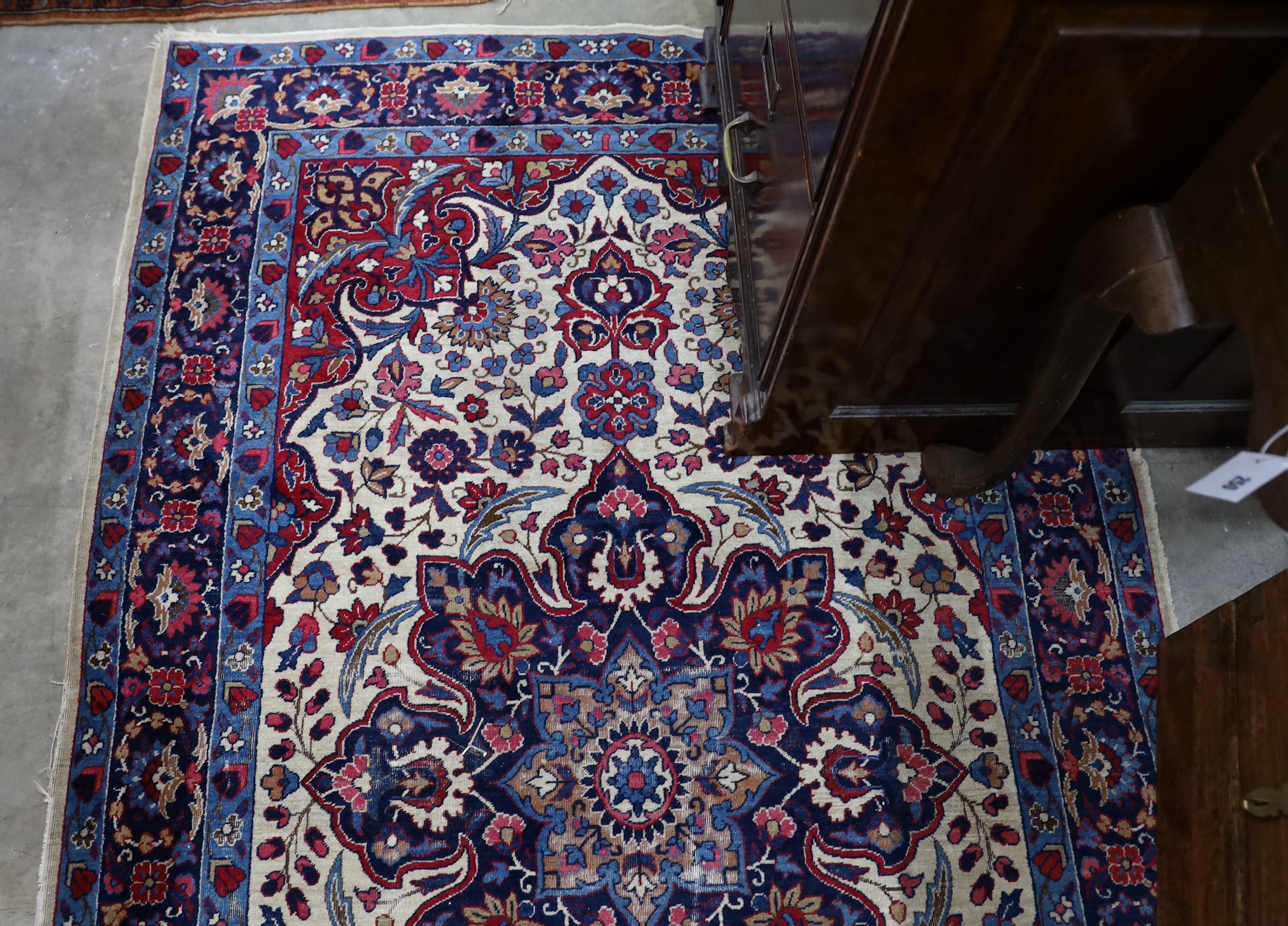 A North West Persian ivory ground rug, 205 x 118cm
